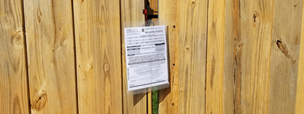 Permit on Wood Fence